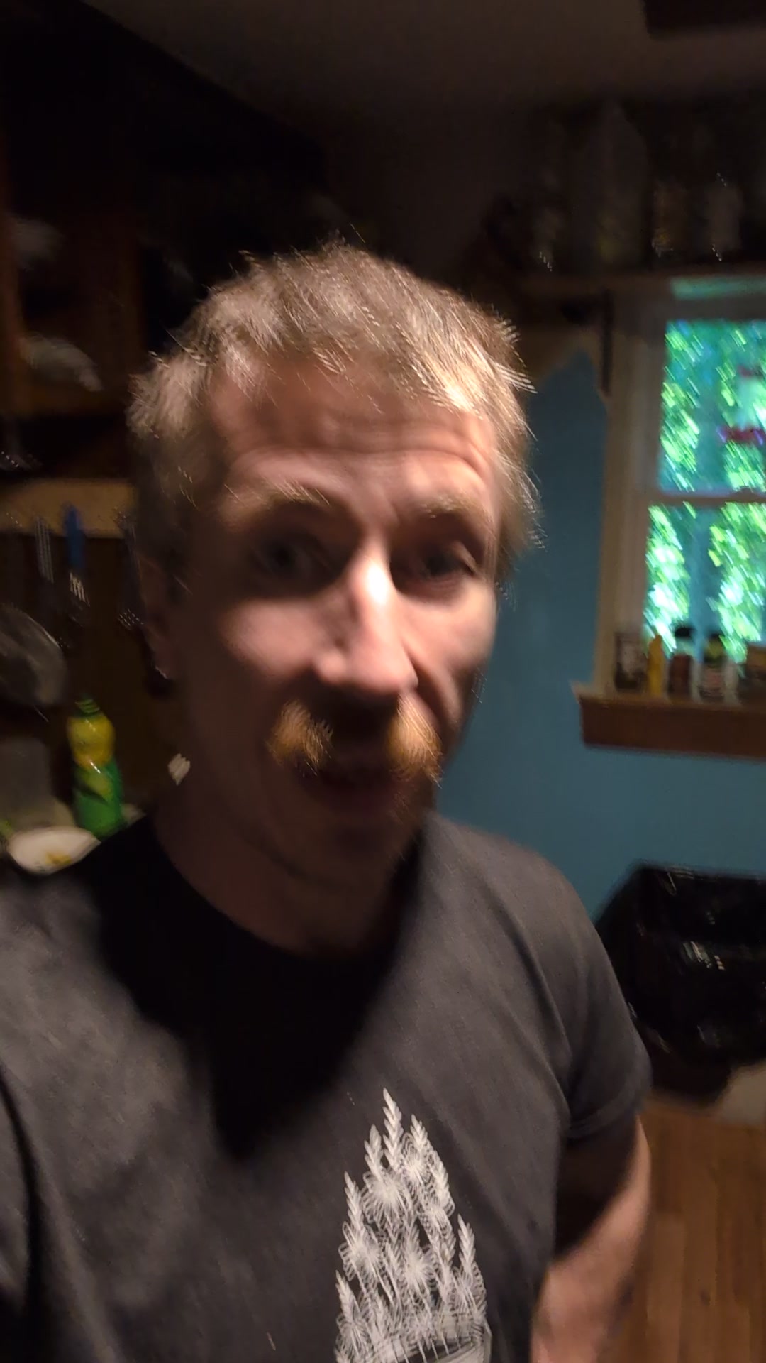 Brian speaking from a home kitchen