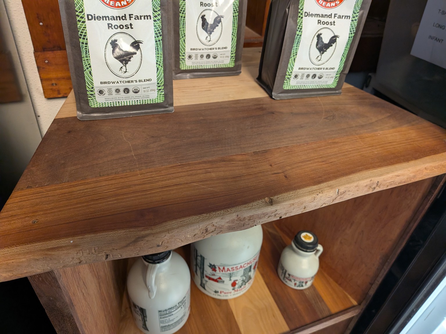Close detail of a live-edge custom retail shelf